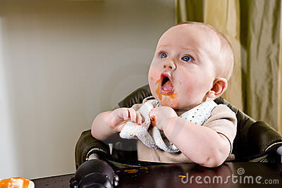 cute-hungry-baby-eating-solid-food-11032069